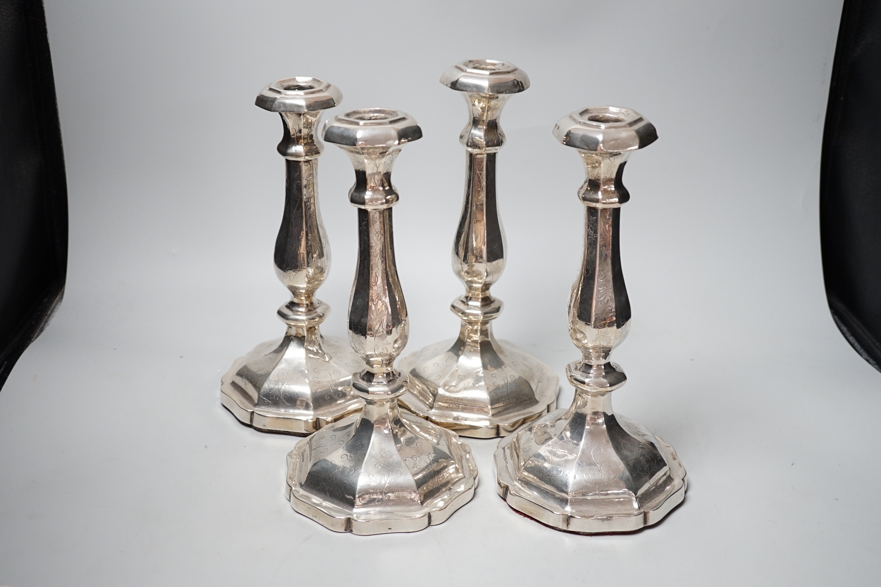 A set of four 19th century Austro-Hungarian white metal candlesticks, dated 1863, height 27.4cm, et infra (a.f.), weighted.